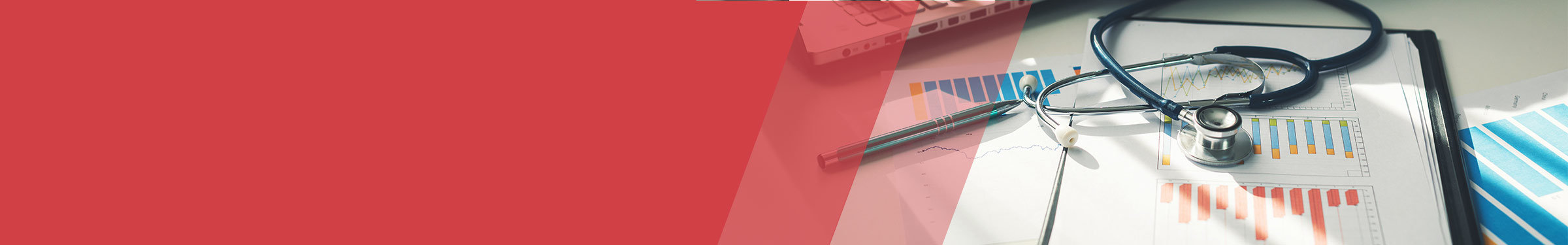 Red section header with a stethoscope resting on top of printed bar graphs and a clipboard, with a pen and a partially visible laptop in the background.
