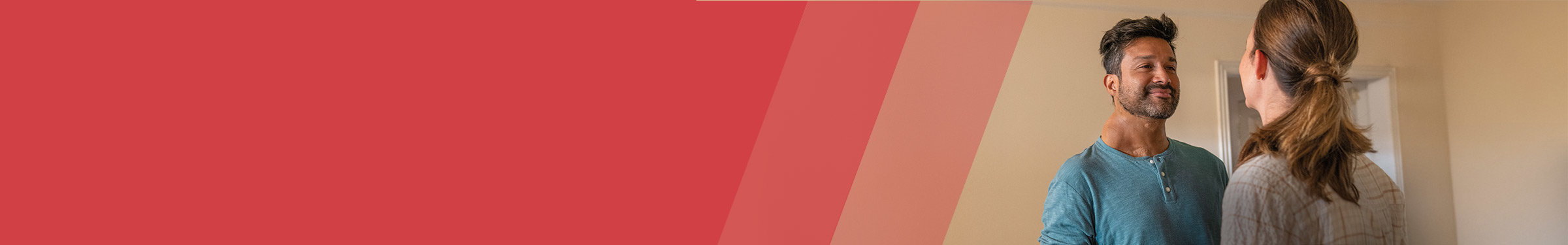 Read section header with man and woman to the right looking and smiling at each other.